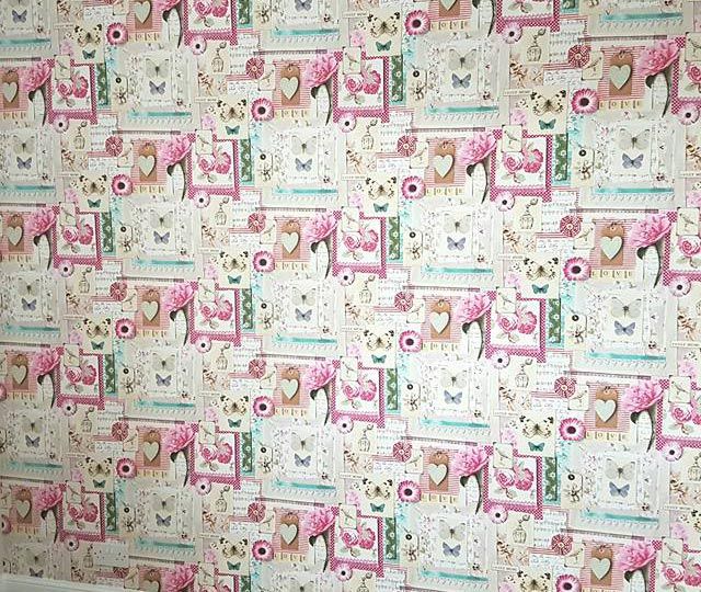 A wallpapered wall that has been completed by our team