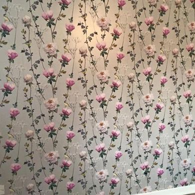A wallpapered wall that our team completed for a client