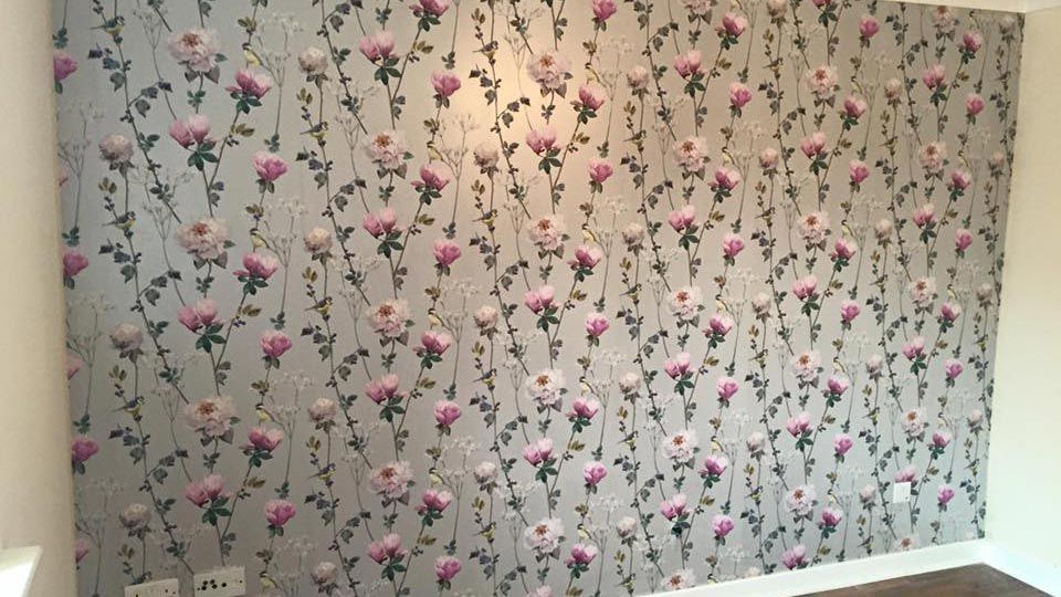 A wallpapered wall that our team completed for a client